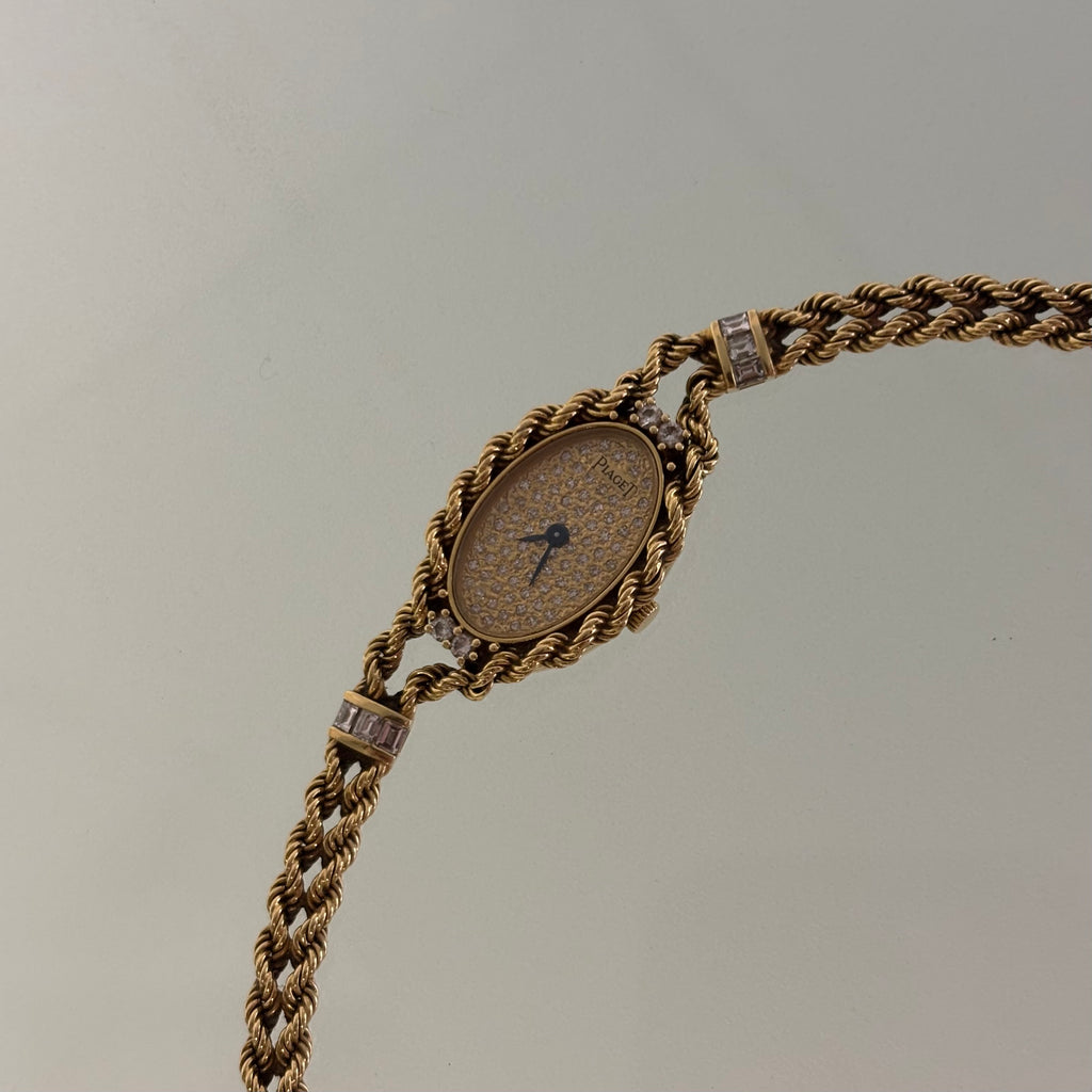 Piaget 18k braceletwatch with diamonds & baguettes