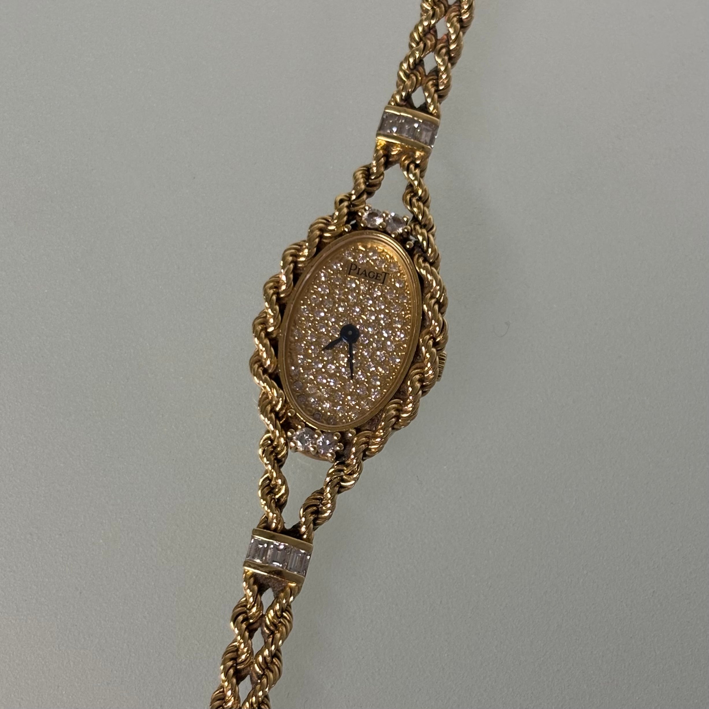 Piaget 18k braceletwatch with diamonds & baguettes