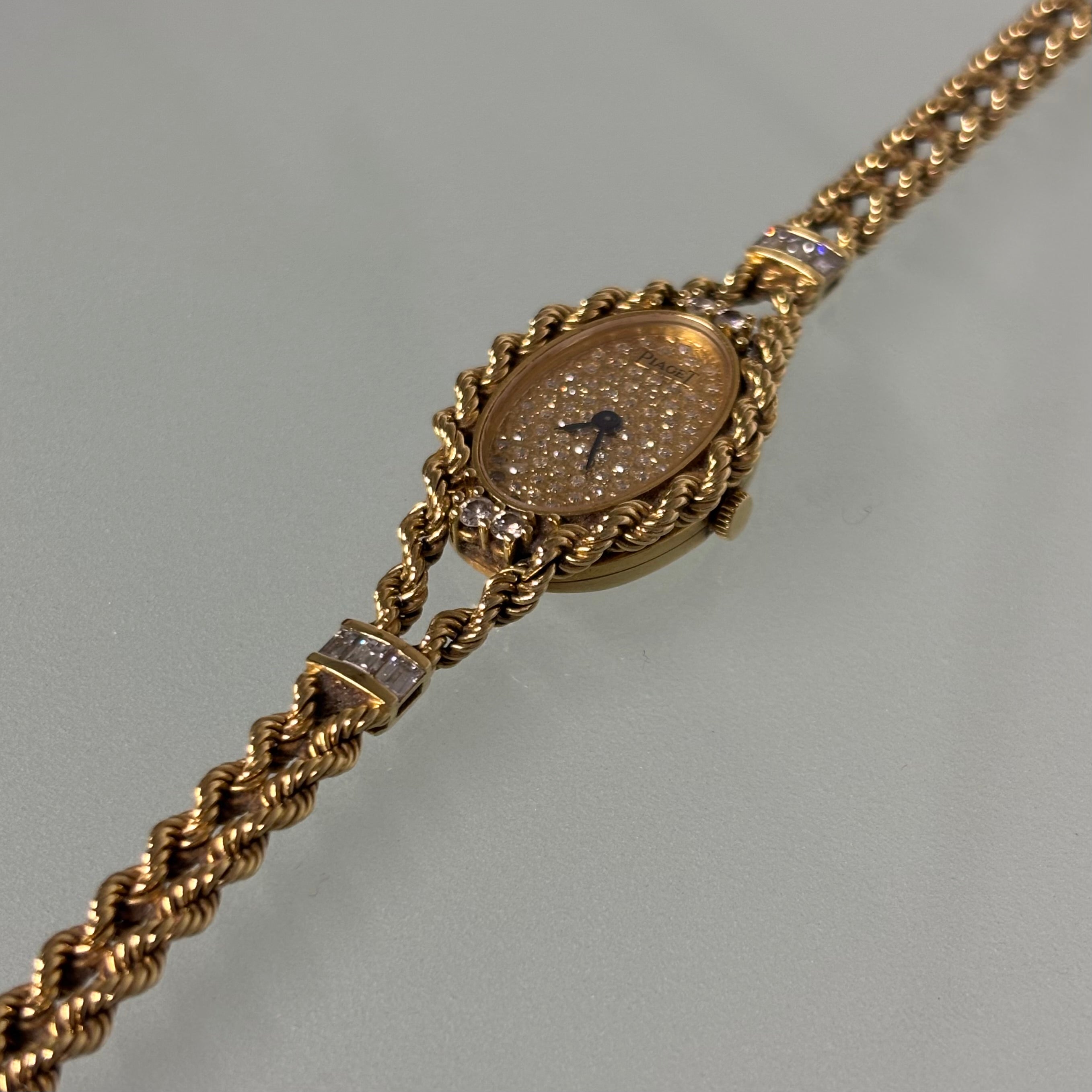 Piaget 18k braceletwatch with diamonds & baguettes