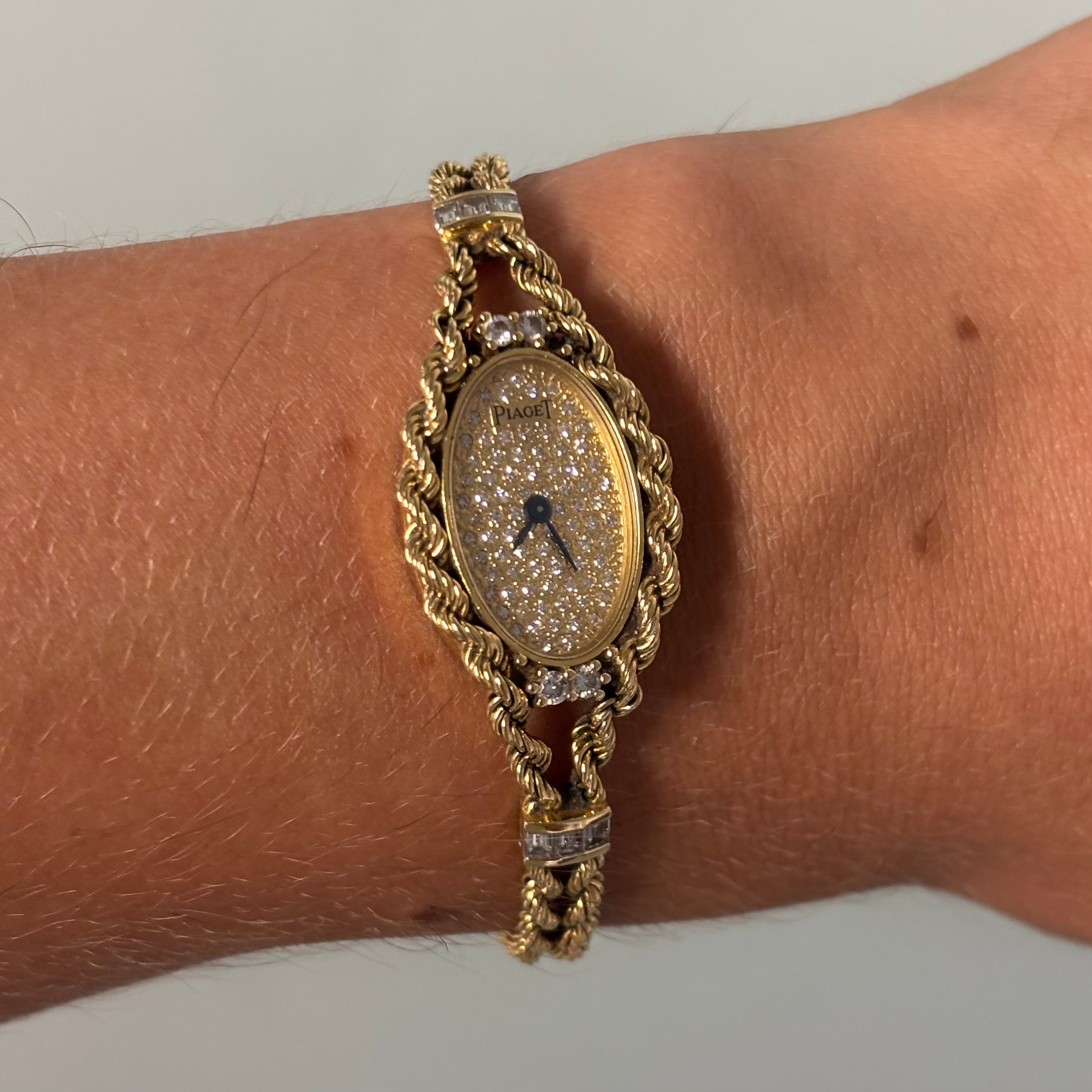Piaget 18k braceletwatch with diamonds & baguettes