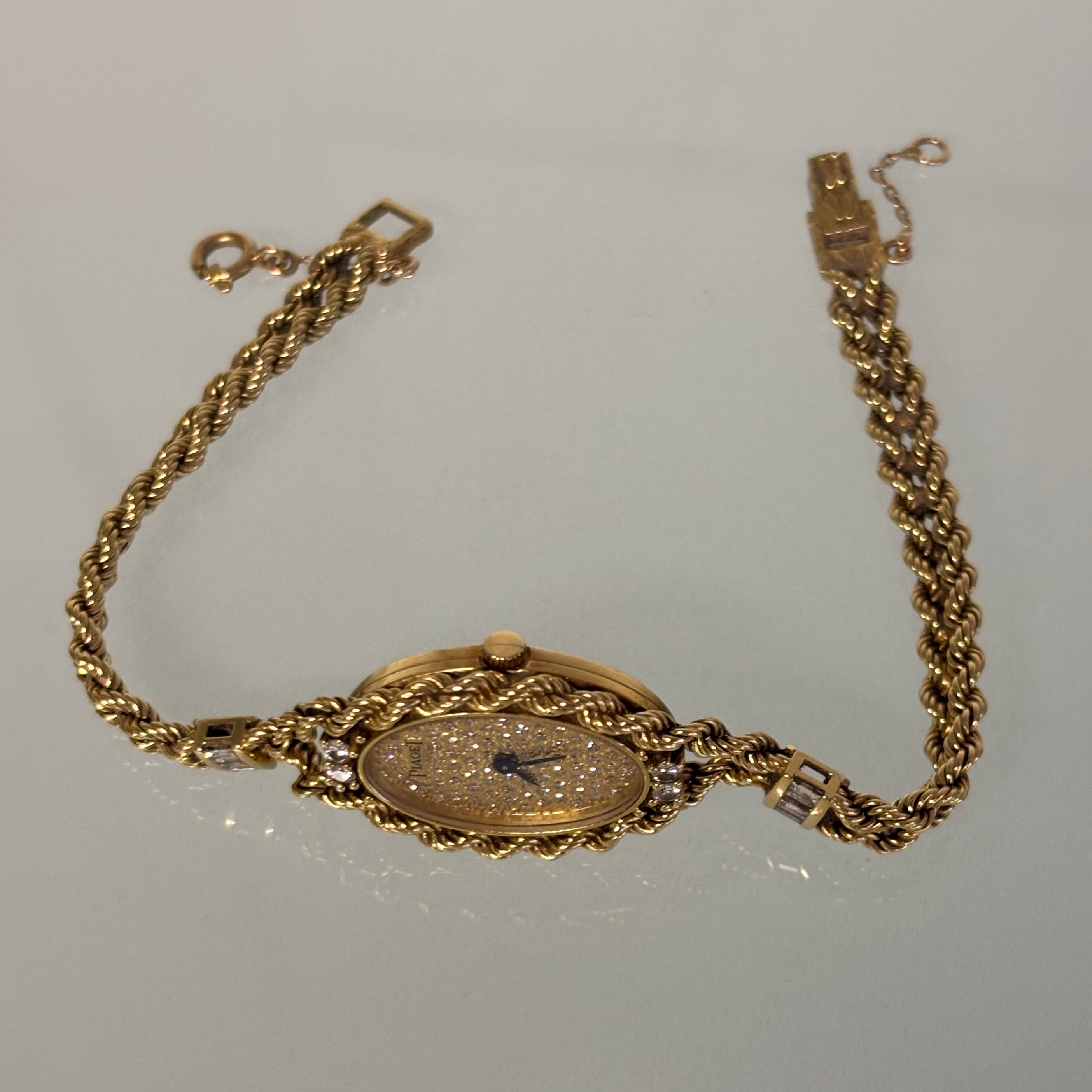 Piaget 18k braceletwatch with diamonds & baguettes