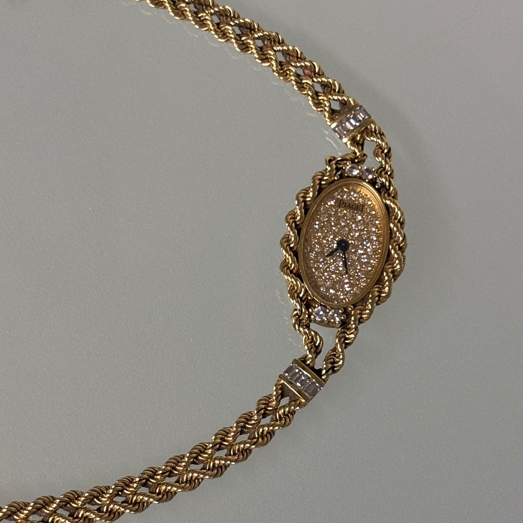 Piaget 18k braceletwatch with diamonds & baguettes