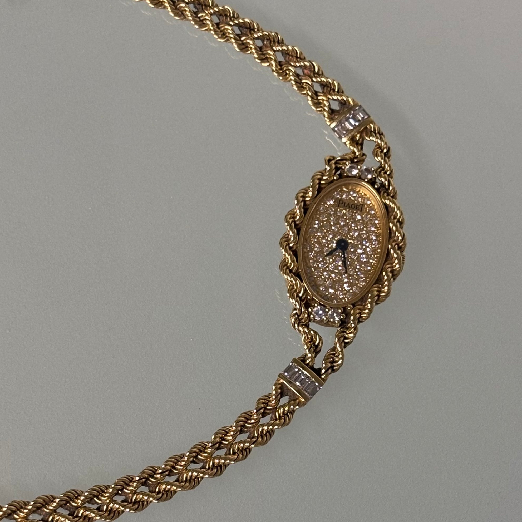 Piaget 18k braceletwatch with diamonds & baguettes