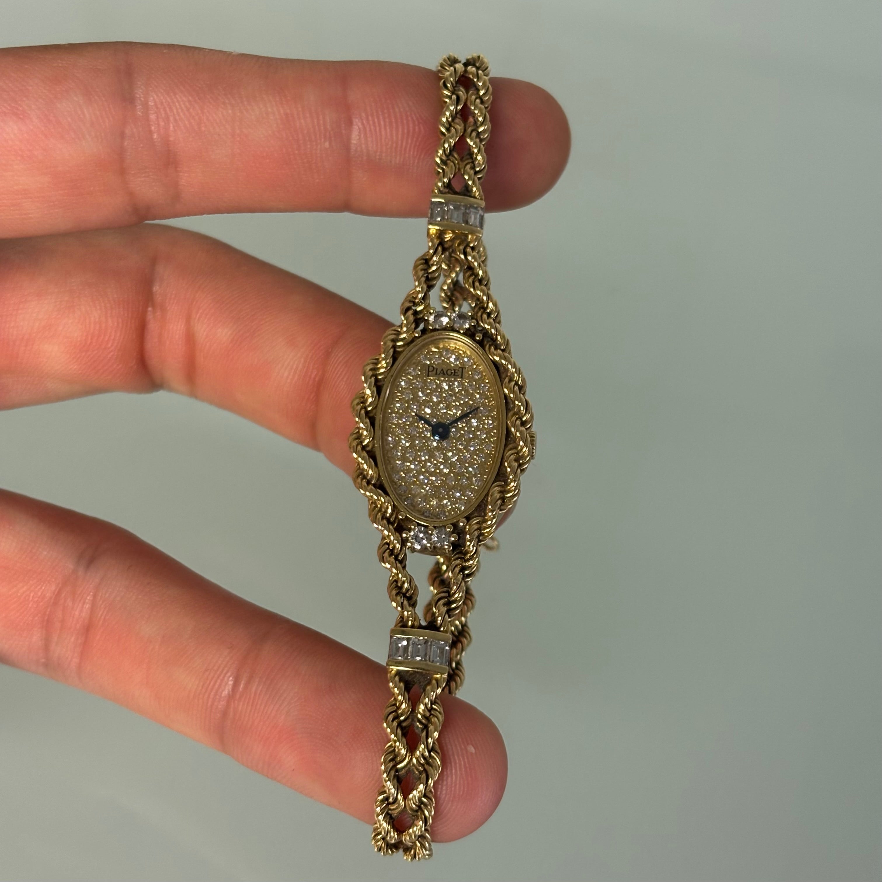 Piaget 18k braceletwatch with diamonds & baguettes