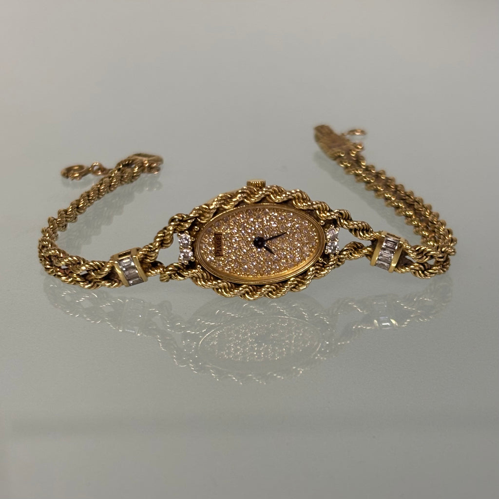 Piaget 18k braceletwatch with diamonds & baguettes