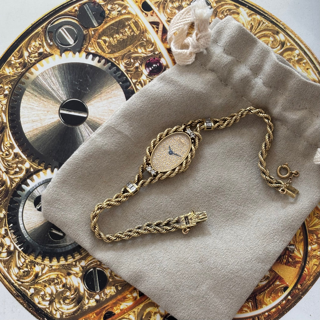 Piaget 18k braceletwatch with diamonds & baguettes
