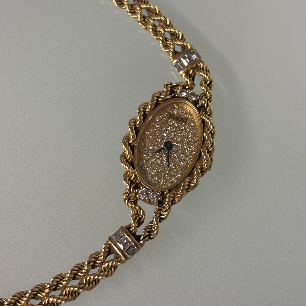 Piaget 18k braceletwatch with diamonds & baguettes