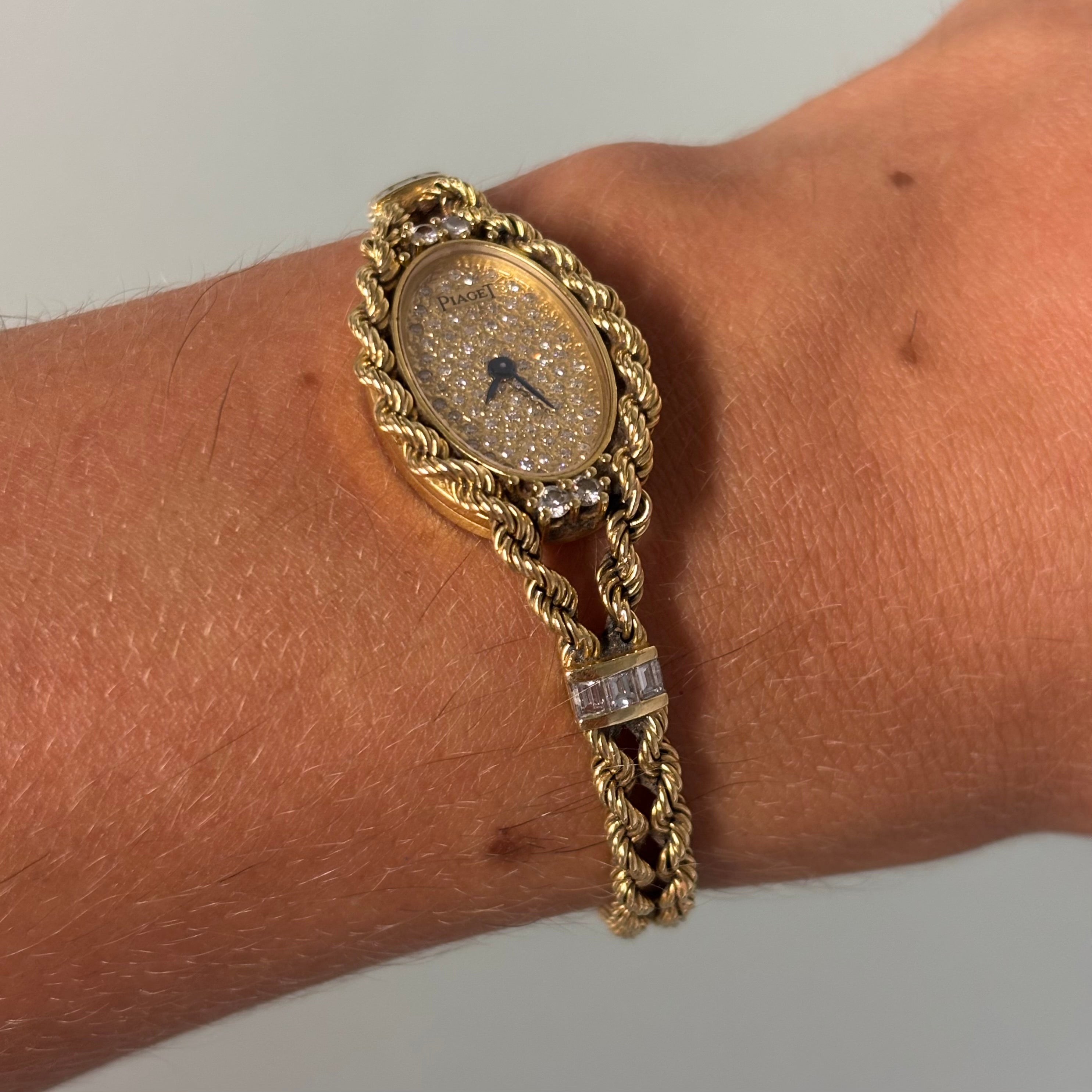 Piaget 18k braceletwatch with diamonds & baguettes