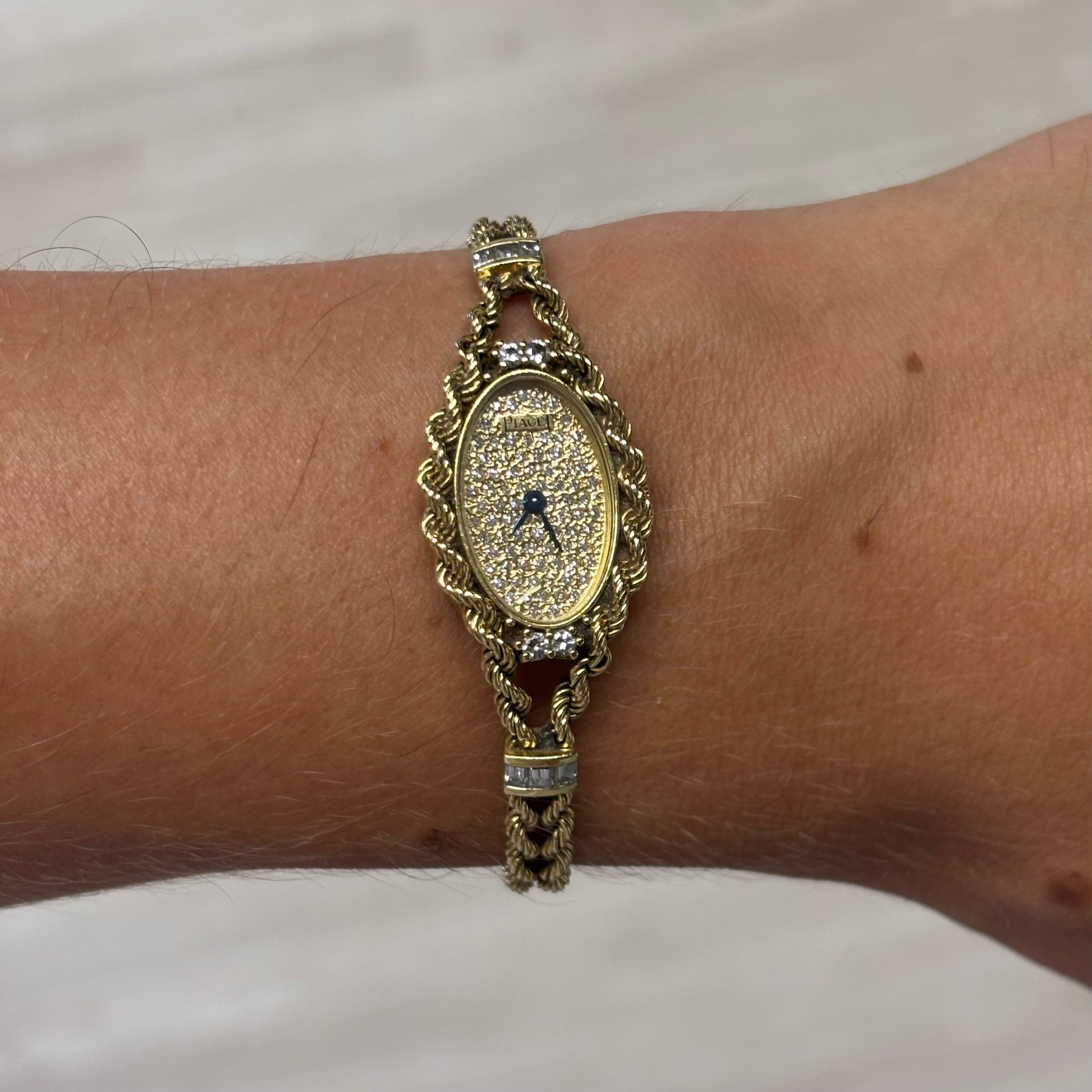 Piaget 18k braceletwatch with diamonds & baguettes