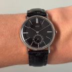 Movado “Fab. Suisse” Wristwatch – Black Dial, Stainless Steel